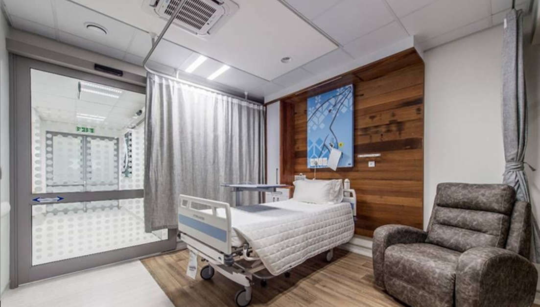 Homely looking hospital ward with wood-look flooring
